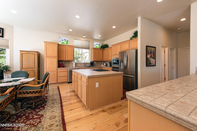 1601 Jones St, Minden, NV 89423 - kitchen featuring stainless steel appliances, plenty of natural light, a kitchen island, recessed lighting, and light wood-type flooring