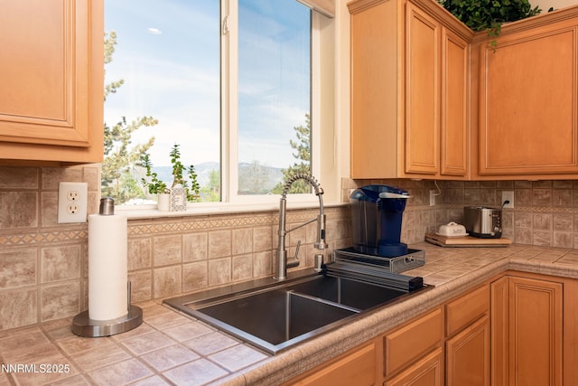 1601 Jones St, Minden, NV 89423 - kitchen with a sink, tasteful backsplash, and tile counters
