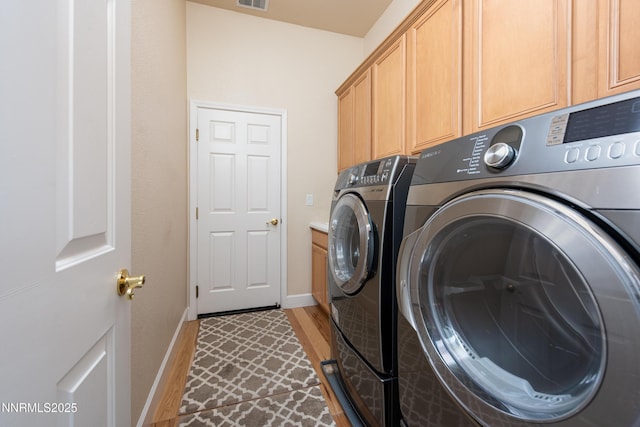 1601 Jones St, Minden, NV 89423 - laundry area with washing machine and clothes dryer, cabinet space, and baseboards