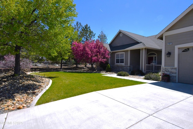 1601 Jones St, Minden, NV 89423 - view of green lawn with driveway and a garage