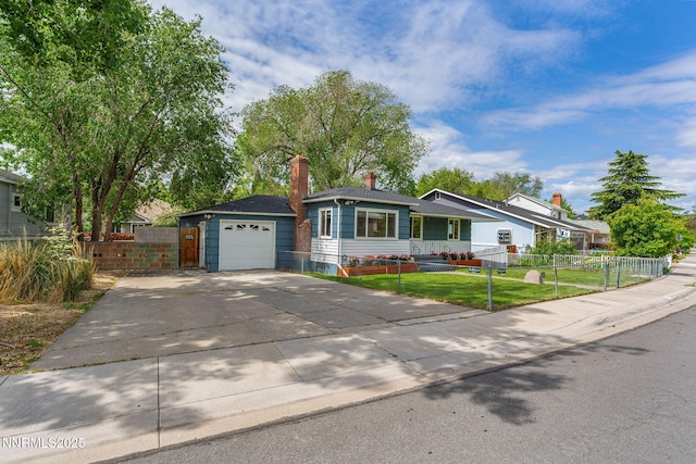 438 Glenmanor Dr, Reno, NV 89509 - ranch-style house with concrete driveway, a chimney, and a detached garage