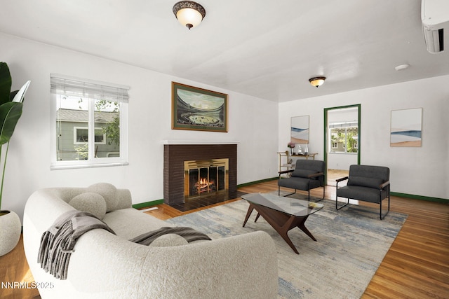 438 Glenmanor Dr, Reno, NV 89509 - living room with wood finished floors, a fireplace with flush hearth, and baseboards