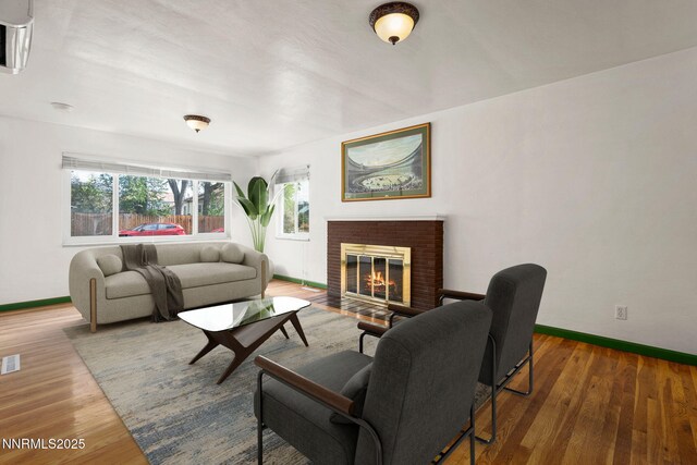 438 Glenmanor Dr, Reno, NV 89509 - living area featuring baseboards, healthy amount of natural light, a fireplace, and wood finished floors