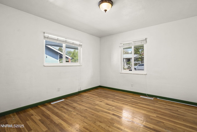 438 Glenmanor Dr, Reno, NV 89509 - unfurnished room featuring baseboards, plenty of natural light, and wood finished floors
