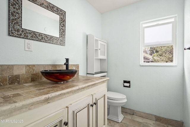 438 Glenmanor Dr, Reno, NV 89509 - bathroom with toilet, stone tile flooring, and vanity