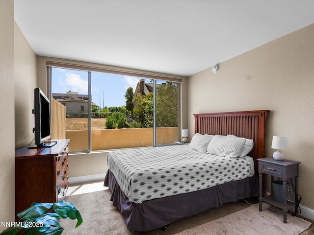 280 Island Ave Unit 302, Reno, NV 89501 - bedroom featuring multiple windows, baseboards, and a textured wall