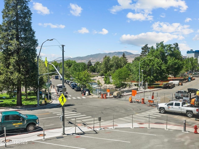280 Island Ave Unit 302, Reno, NV 89501 - view of asphalt road with a mountain view, street lighting, traffic signs, and curbs