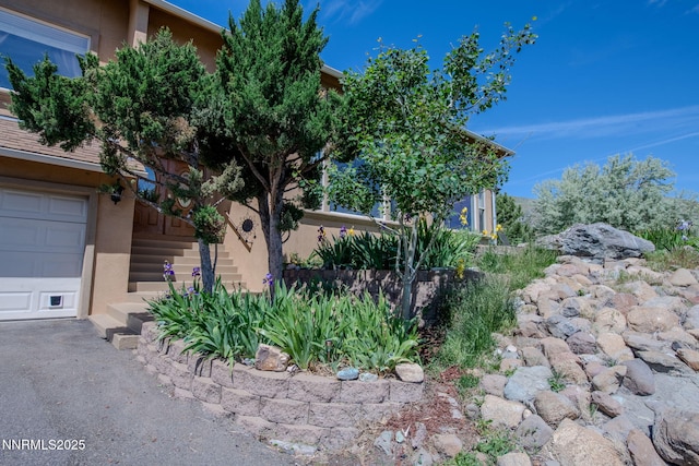 6 Canyon Dr, Carson City, NV 89703 - view of front of property with stucco siding and a garage