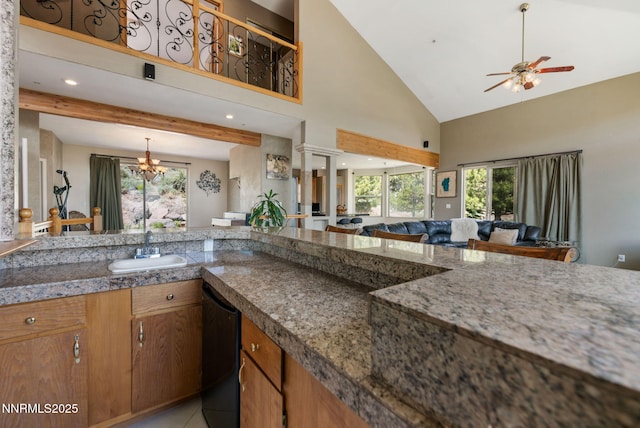 6 Canyon Dr, Carson City, NV 89703 - kitchen with a sink, high vaulted ceiling, plenty of natural light, ceiling fan, and brown cabinetry