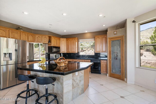6 Canyon Dr, Carson City, NV 89703 - kitchen with black appliances, a sink, a center island, a kitchen bar, and recessed lighting