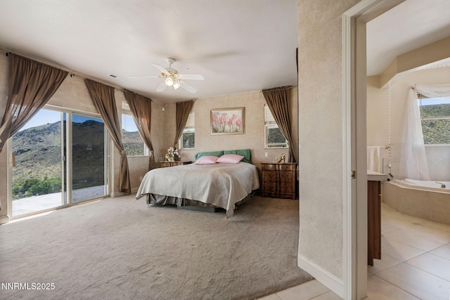 6 Canyon Dr, Carson City, NV 89703 - bedroom featuring a mountain view, light colored carpet, access to outside, light tile patterned floors, and ceiling fan