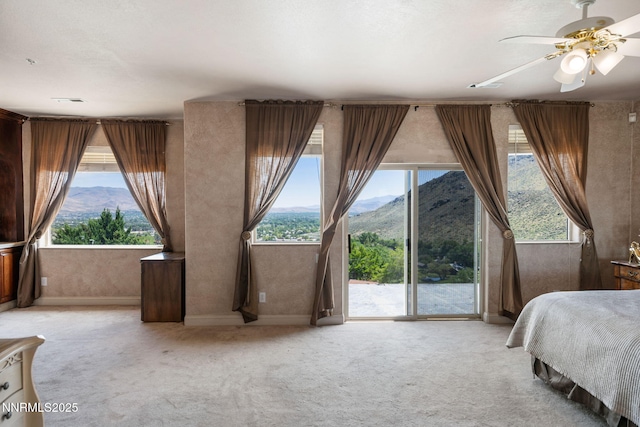 6 Canyon Dr, Carson City, NV 89703 - bedroom featuring a mountain view, access to exterior, light carpet, and ceiling fan