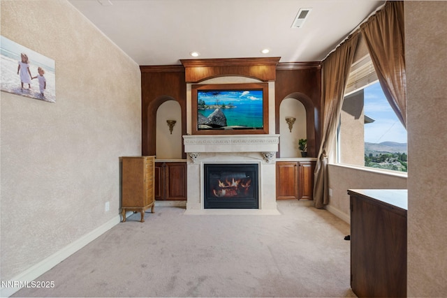 6 Canyon Dr, Carson City, NV 89703 - unfurnished living room featuring light colored carpet, a fireplace with flush hearth, baseboards, a textured wall, and recessed lighting