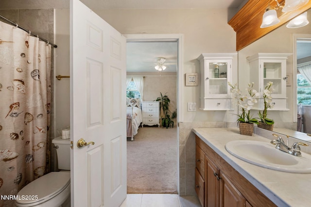 6 Canyon Dr, Carson City, NV 89703 - ensuite bathroom with vanity, toilet, a ceiling fan, tile patterned floors, and a shower with curtain