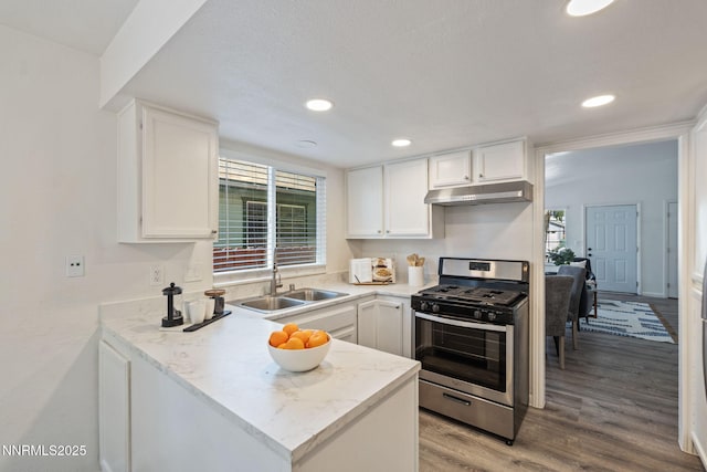 1821 Fargo Way, Sparks, NV 89434 - kitchen featuring gas range, a sink, under cabinet range hood, white cabinetry, and light wood-style flooring