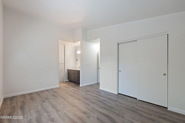 1821 Fargo Way, Sparks, NV 89434 - unfurnished bedroom with light wood-style flooring, a closet, baseboards, and ensuite bath