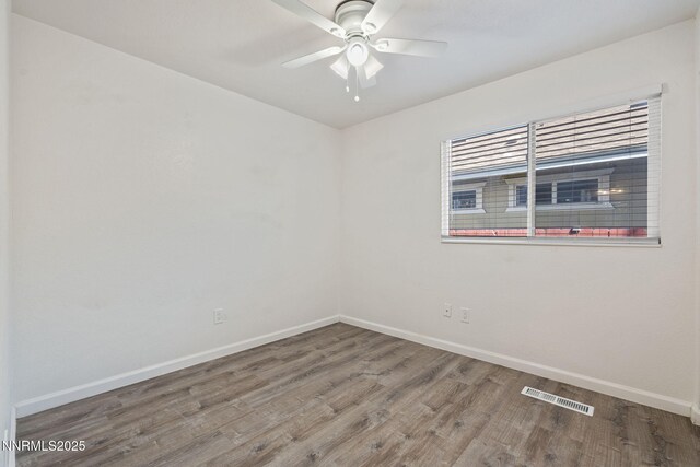 1821 Fargo Way, Sparks, NV 89434 - spare room featuring baseboards, wood finished floors, and ceiling fan