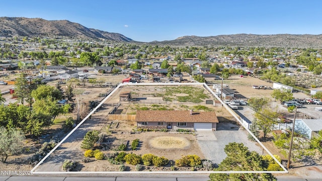 11815 Mistletoe St, Reno, NV 89506 - aerial perspective of suburban area featuring a mountainous background and property boundaries highlighted