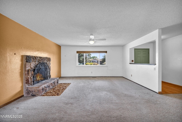 11815 Mistletoe St, Reno, NV 89506 - unfurnished living room featuring carpet, a ceiling fan, a stone fireplace, a textured ceiling, and a textured wall