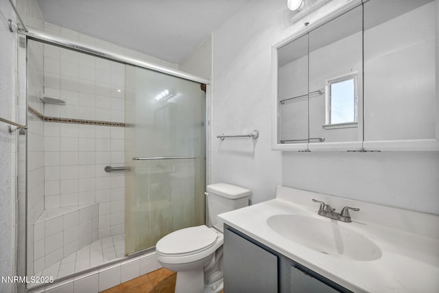 11815 Mistletoe St, Reno, NV 89506 - full bath with toilet, a shower stall, vanity, and tile patterned floors