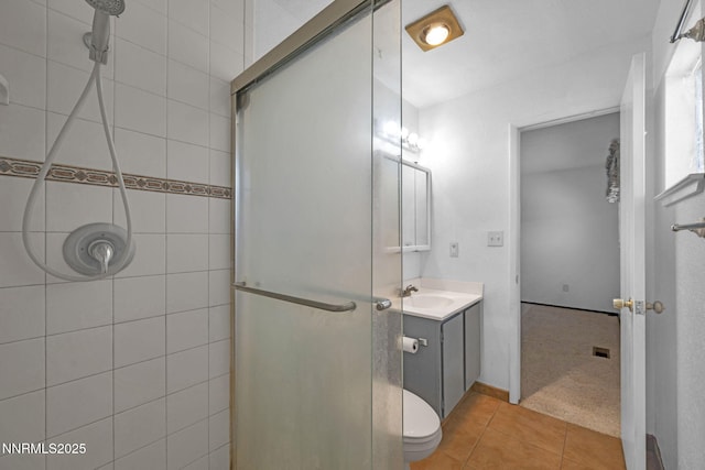 11815 Mistletoe St, Reno, NV 89506 - full bath featuring a shower stall, vanity, tile patterned floors, and toilet
