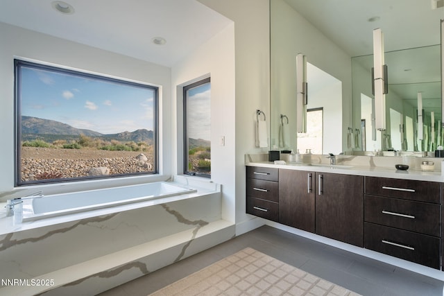 310 James Canyon Loop, Genoa, NV 89411 - full bath featuring vanity, a bath, plenty of natural light, and tile patterned floors