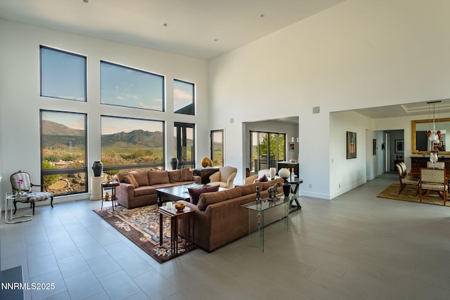 310 James Canyon Loop, Genoa, NV 89411 - living area with a mountain view, a high ceiling, and baseboards