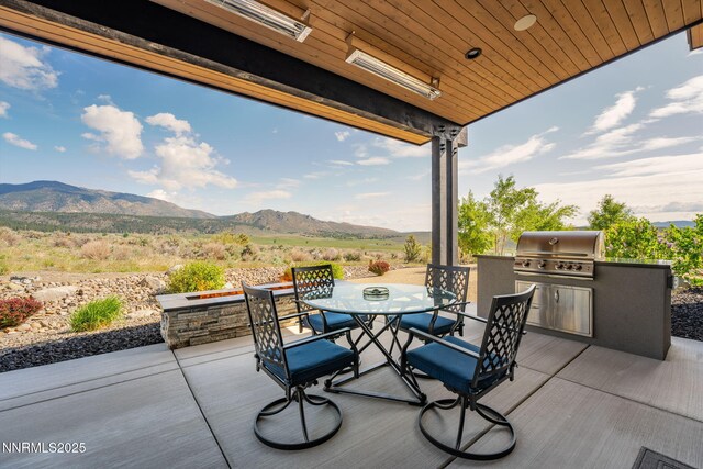310 James Canyon Loop, Genoa, NV 89411 - view of patio / terrace featuring outdoor dining area and a mountain view