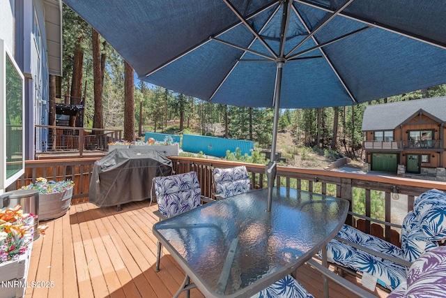 223 Lyons Ave, Zephyr Cove, NV 89448 - wooden terrace featuring outdoor dining space and grilling area
