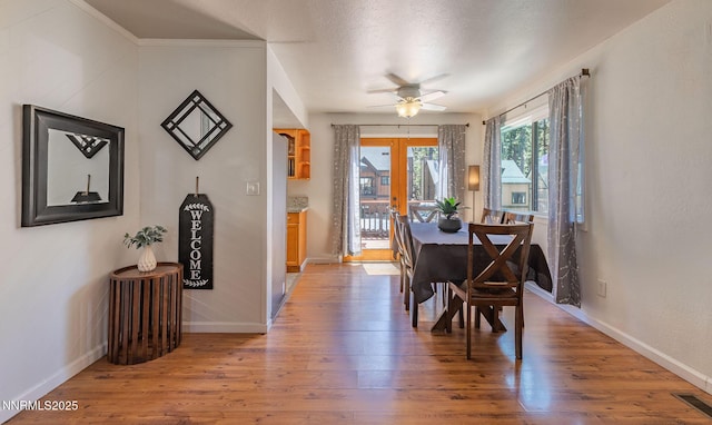 223 Lyons Ave, Zephyr Cove, NV 89448 - dining area with baseboards, light wood-style floors, a ceiling fan, and french doors