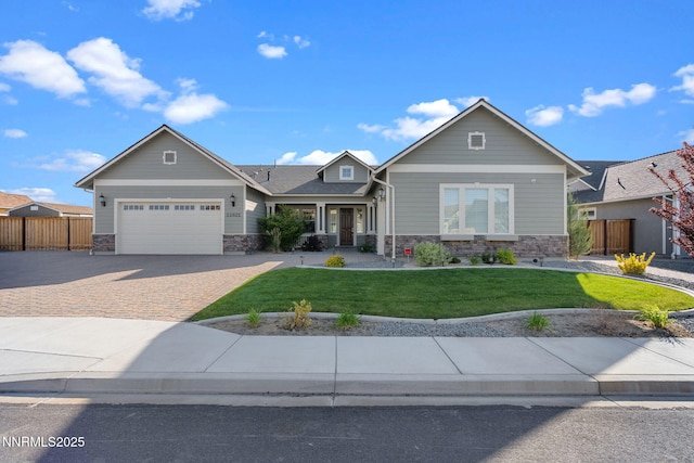 11621 Desert Shadow Dr, Sparks, NV 89441 - craftsman-style home with stone siding, decorative driveway, and an attached garage