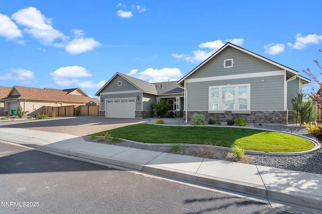 11621 Desert Shadow Dr, Sparks, NV 89441 - view of front of house with stone siding, driveway, and an attached garage