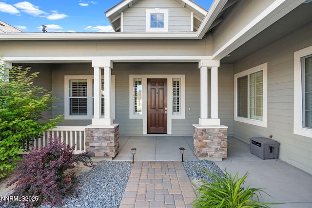11621 Desert Shadow Dr, Sparks, NV 89441 - view of exterior entry with a porch and stone siding