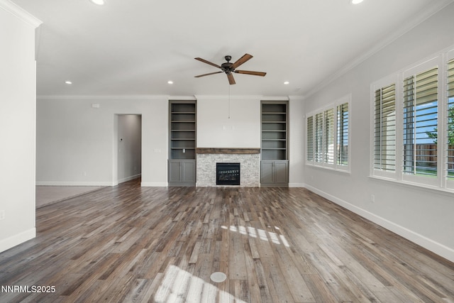 11621 Desert Shadow Dr, Sparks, NV 89441 - unfurnished living room with a ceiling fan, wood finished floors, ornamental molding, recessed lighting, and a fireplace