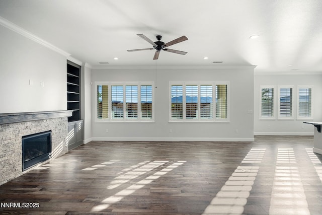11621 Desert Shadow Dr, Sparks, NV 89441 - unfurnished living room with ceiling fan, a stone fireplace, ornamental molding, recessed lighting, and wood finished floors