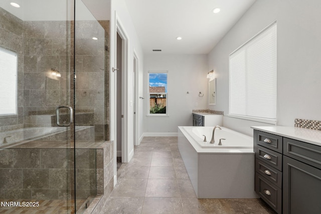 11621 Desert Shadow Dr, Sparks, NV 89441 - bathroom featuring vanity, a garden tub, a stall shower, tile patterned floors, and recessed lighting