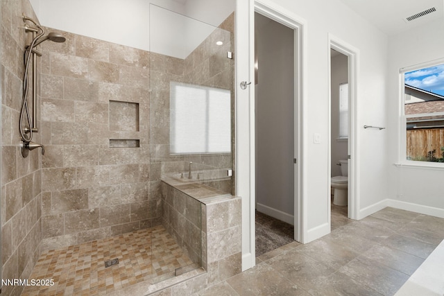 11621 Desert Shadow Dr, Sparks, NV 89441 - full bath featuring tiled shower, toilet, and baseboards