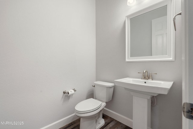 11621 Desert Shadow Dr, Sparks, NV 89441 - half bath with wood finished floors, toilet, and baseboards