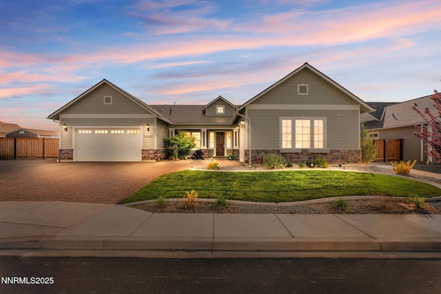 11621 Desert Shadow Dr, Sparks, NV 89441 - view of front of home with stone siding, decorative driveway, and a garage