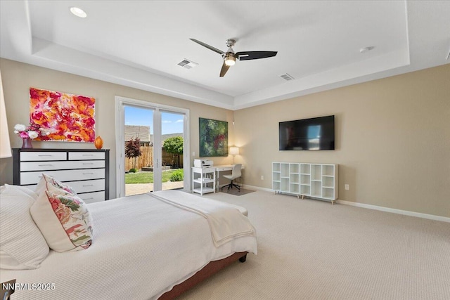 9822 Dyevera Ln, Reno, NV 89521 - bedroom featuring access to exterior, baseboards, a tray ceiling, carpet flooring, and a ceiling fan