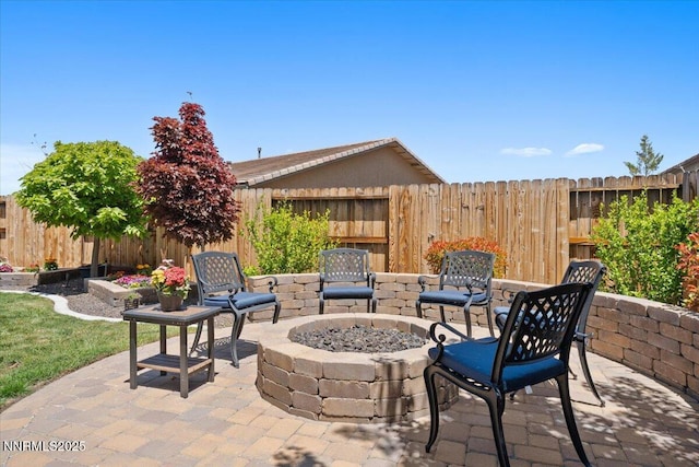 9822 Dyevera Ln, Reno, NV 89521 - fenced backyard with a patio area and a fire pit