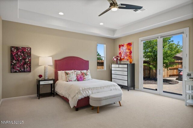 9822 Dyevera Ln, Reno, NV 89521 - bedroom featuring light colored carpet, a tray ceiling, access to outside, and recessed lighting