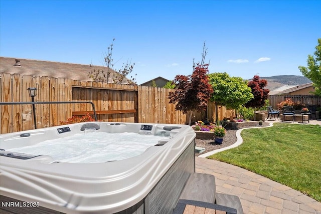 9822 Dyevera Ln, Reno, NV 89521 - view of patio / terrace with a hot tub