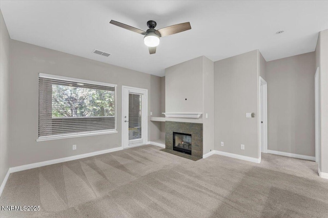 900 S Meadows Pkwy Unit 5222, Reno, NV 89521 - unfurnished living room with carpet floors, ceiling fan, baseboards, and a tiled fireplace