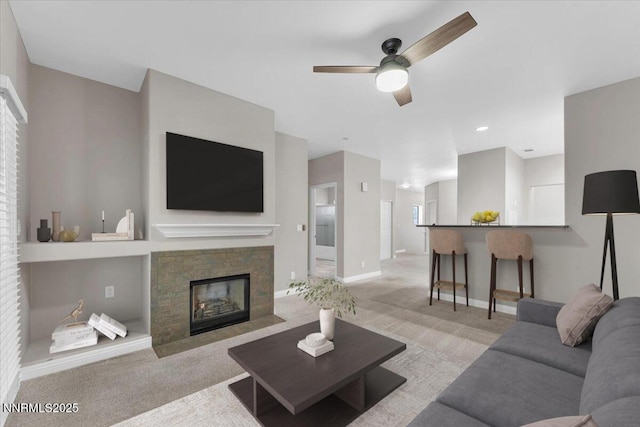 900 S Meadows Pkwy Unit 5222, Reno, NV 89521 - carpeted living area featuring ceiling fan, baseboards, a fireplace with flush hearth, and healthy amount of natural light