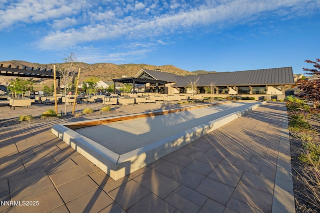 3060 Feathertop Dr, Reno, NV 89521 - view of swimming pool featuring a bocce ball area, a mountain view, and a pergola