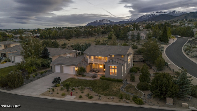 2965 Roundrock Ct, Reno, NV 89511 - view of front of property featuring a balcony, driveway, a garage, and a mountain view