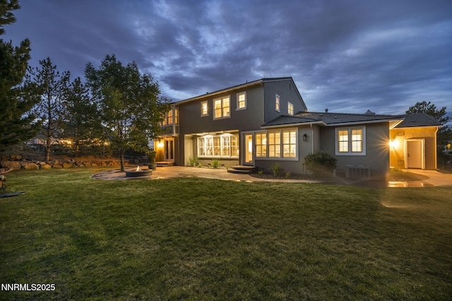 2965 Roundrock Ct, Reno, NV 89511 - back of property with a patio area, stucco siding, and a yard