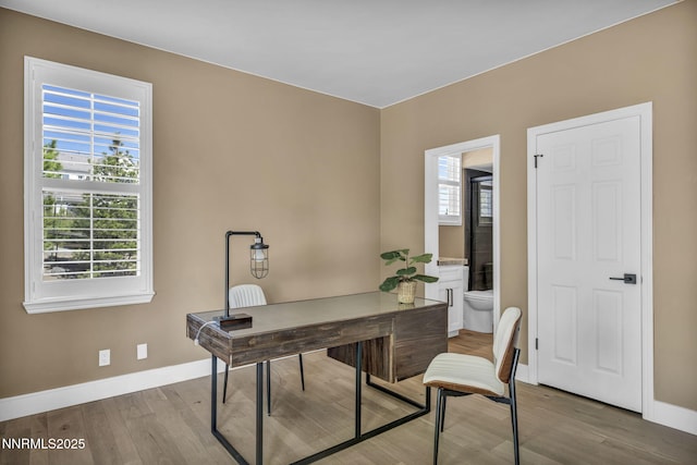 2965 Roundrock Ct, Reno, NV 89511 - office area featuring baseboards, wood finished floors, and plenty of natural light