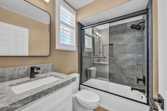 2965 Roundrock Ct, Reno, NV 89511 - bathroom featuring shower / bath combination with glass door, vanity, and toilet